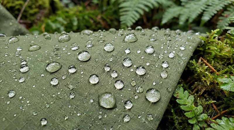 Beading water droplets on DWR-treated fabric